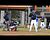 Tyson Seymour climbs fence to catch foul ball.